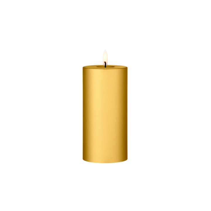Ester & Erik LED pillar candle in gold with lifelike glow, ideal for events and everyday elegance.