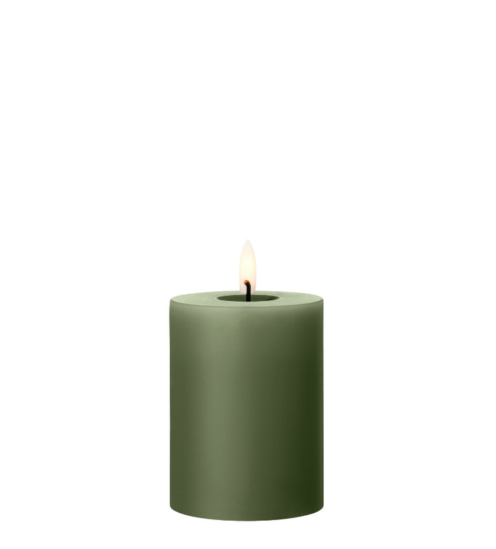 Ester & Erik LED pillar candle in green with lifelike glow, ideal for events and everyday use.
