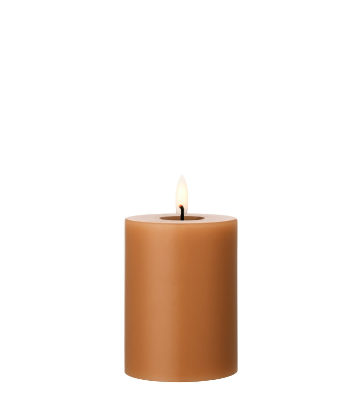 Ester & Erik LED Pillar Candle in warm brown, featuring a lifelike glow, perfect for any decor or event.