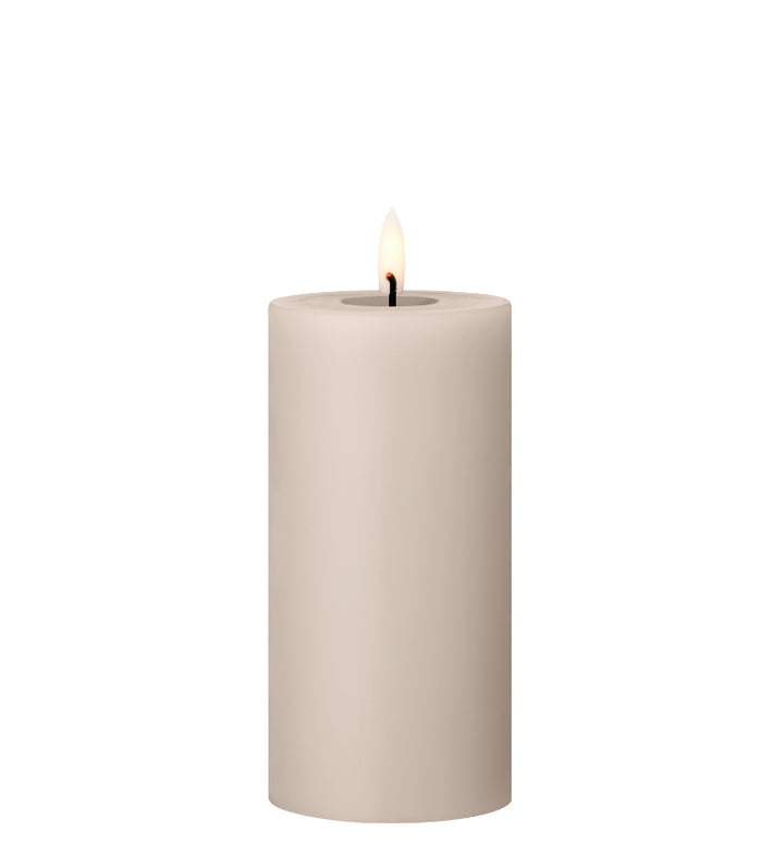Ester & Erik LED Pillar Candle with lifelike glow in light beige, perfect for elegant decor and special occasions.