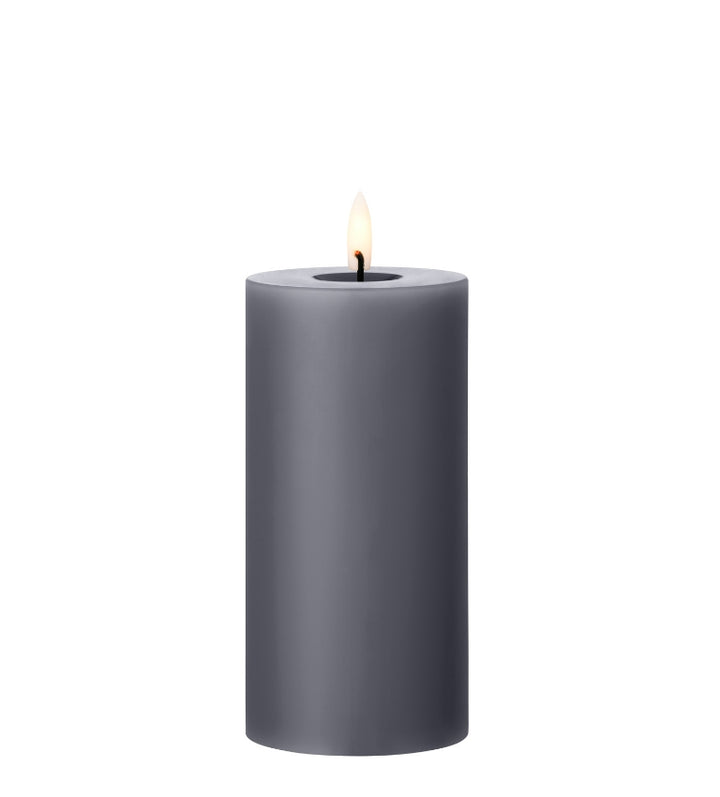 Ester & Erik LED pillar candle in gray with lifelike glow, perfect for elegant decor in any setting.