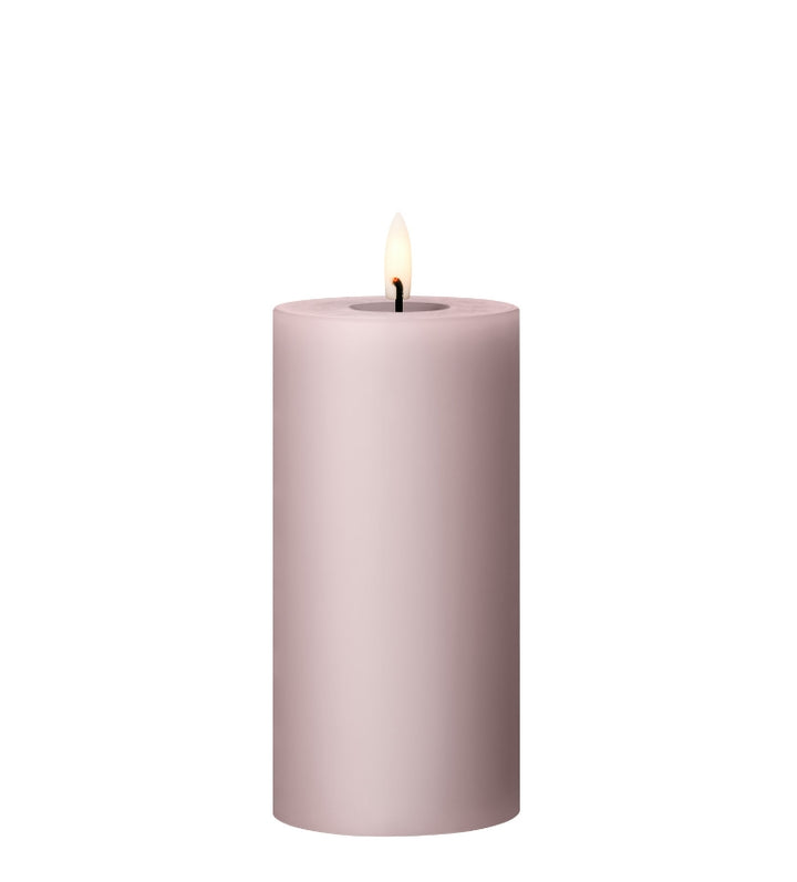 Ester & Erik LED pillar candle with lifelike glow, elegant design, soft lilac color for home decor and special events.