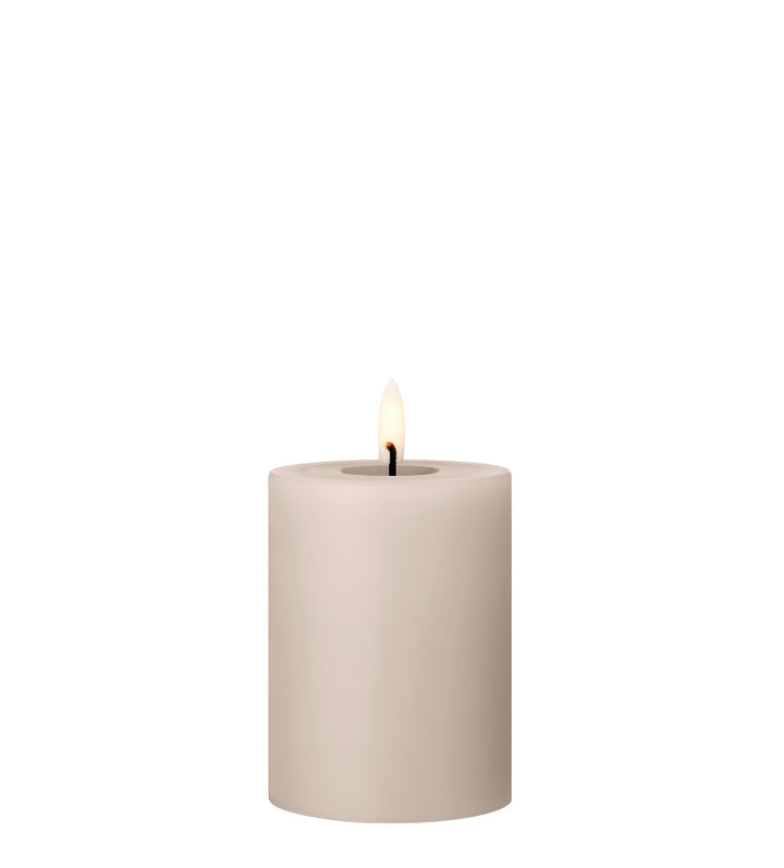 Ester & Erik LED Pillar Candle with lifelike glow, showcasing a luxurious beige design for elegant decor.