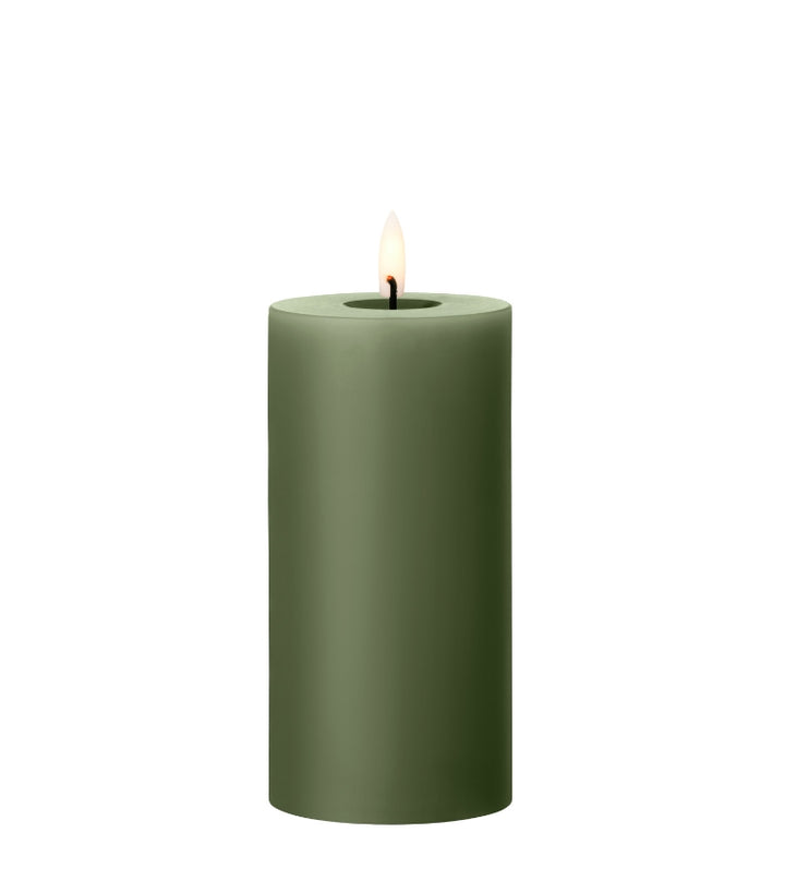 Ester & Erik green LED pillar candle with lifelike glow for home decor or special events.