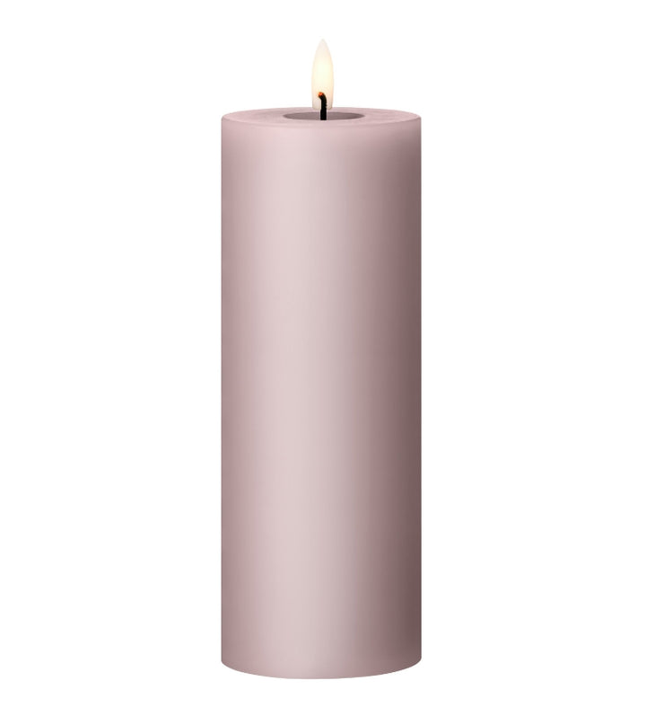Ester & Erik LED pillar candle in soft pink with lifelike glow, perfect for home decor and special events.