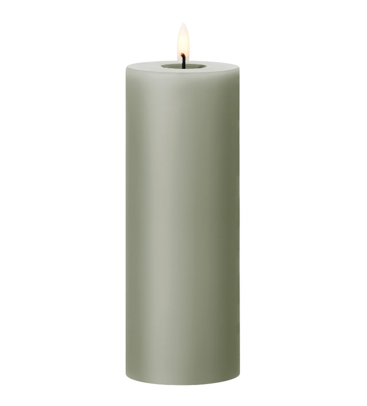 Ester & Erik LED pillar candle in soft green with lifelike glow, perfect for special events and everyday elegance.