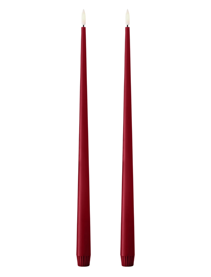 Ester & Erik LED taper candles in deep red color, elegantly designed for modern interiors.