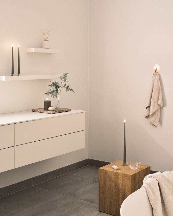 Elegant Ester & Erik LED taper candles in a modern bathroom setting, illuminating a soothing ambiance.