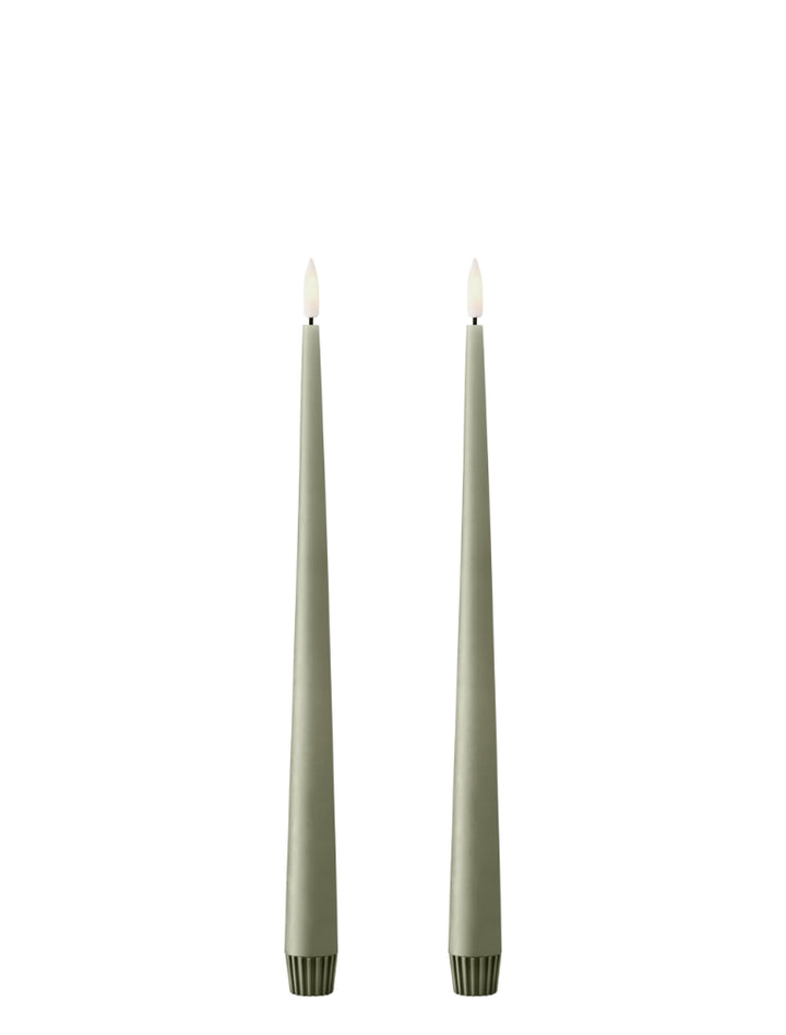 Ester & Erik LED taper candles in elegant green, offering a sophisticated glow for modern decor.