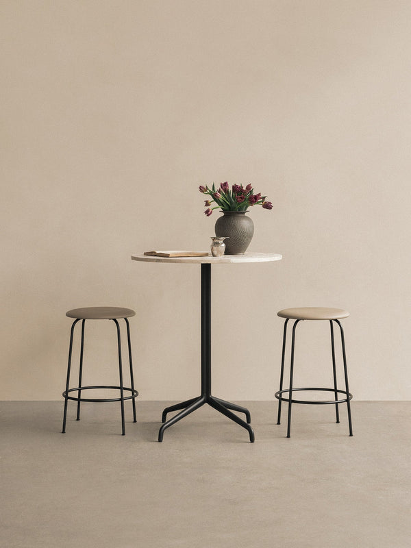 Afteroom Counter Stool, Upholstered Seat by Audo Copenhagen - Effortlessly blend style and comfort with the Afteroom Counter Stool. Crafted with clean lines and a sturdy steel base, this stool adds durability to any space. Customize the upholstery and cho