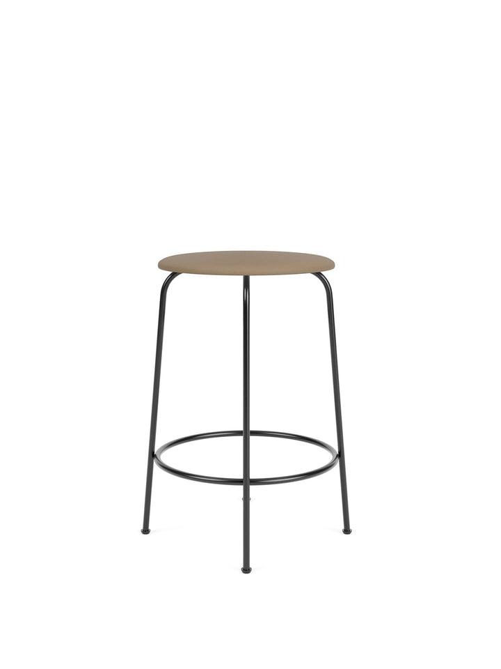 Afteroom Counter Stool, Upholstered Seat by Audo Copenhagen - Effortlessly blend style and comfort with the Afteroom Counter Stool. Crafted with clean lines and a sturdy steel base, this stool adds durability to any space. Customize the upholstery and cho
