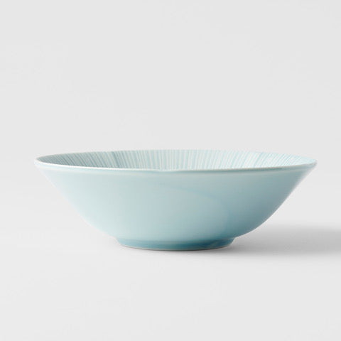 Ice blue bowl with textured interior, perfect for soups and salads, enhancing any table setting.