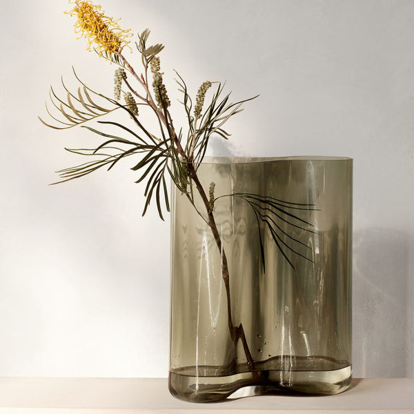 AUDO CPH (ex MENU) Aer Vase, H33cm in Smoke by Audo Copenhagen - Experience pure sophistication and absolute beauty with the AUDO CPH (ex MENU) Aer Vase, H33cm in Smoke. This stunning piece is inspired by the spiraling movement of air and is available in