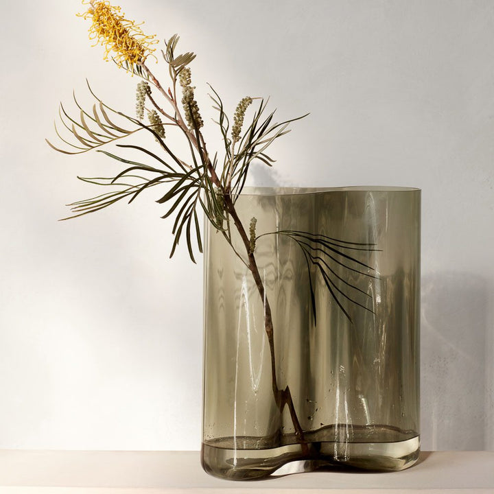 AUDO CPH (ex MENU) Aer Vase, H33cm in Smoke by Audo Copenhagen - Experience pure sophistication and absolute beauty with the AUDO CPH (ex MENU) Aer Vase, H33cm in Smoke. This stunning piece is inspired by the spiraling movement of air and is available in