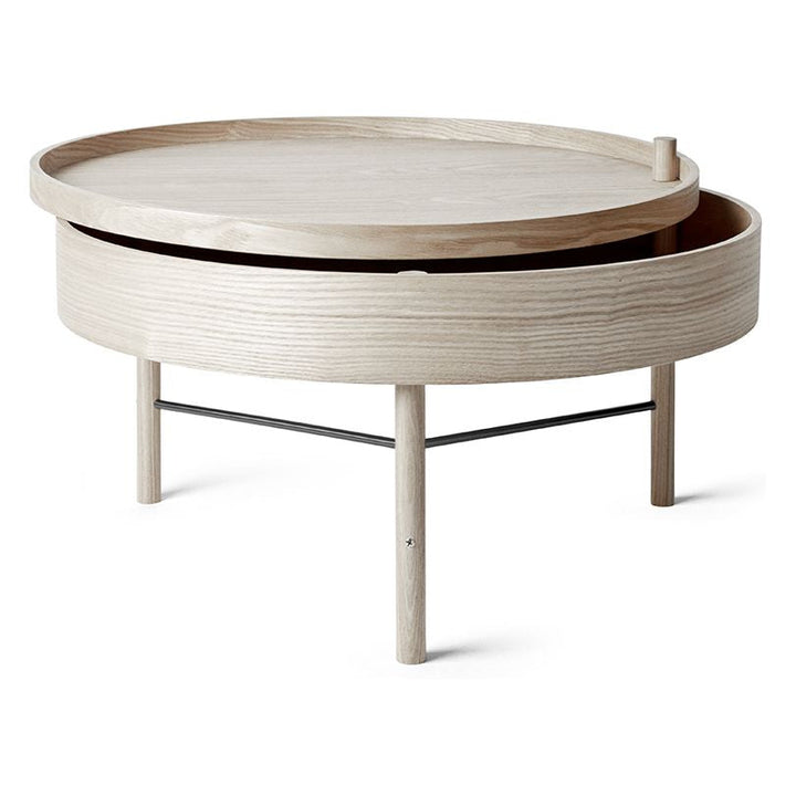 Turning Table by Audo Copenhagen - German designer Theresa Rand was experimenting with ways of combining a table and storage when she stumbled upon the idea of a lid that opens by rotating it around one of the legs. The result is elegant, unpretentious an