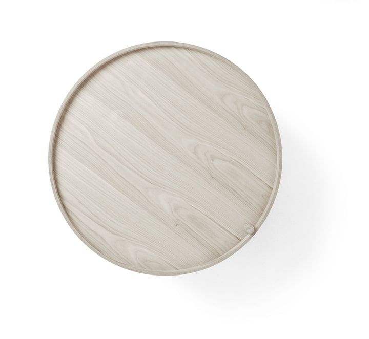 Turning Table by Audo Copenhagen - German designer Theresa Rand was experimenting with ways of combining a table and storage when she stumbled upon the idea of a lid that opens by rotating it around one of the legs. The result is elegant, unpretentious an