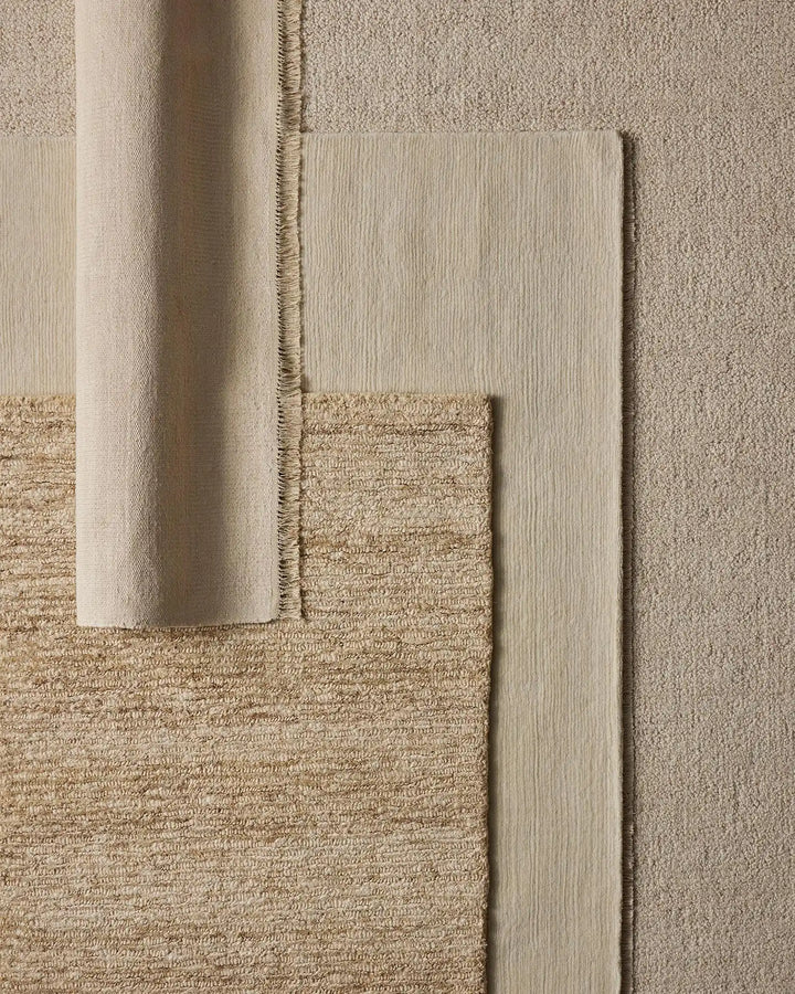 Emilio Canvas - Premium Linen Rug for Your Home Emilio Canvas is a light beige-cream rug that adds natural elegance and charm to any space with its refined design.