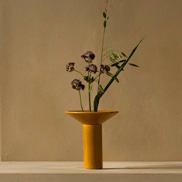 AUDO CPH (ex MENU) Hana Vase, H14.5cm, Ochre by Audo Copenhagen - Hana is inspired by ikebana, the ancient Japanese art of flower arranging that uses few but carefully chosen and artfully positioned stems. Shaped around a central ceramic flower frog, or k