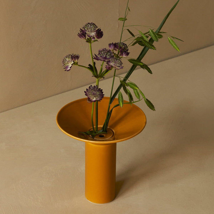 AUDO CPH (ex MENU) Hana Vase, H14.5cm, Ochre by Audo Copenhagen - Hana is inspired by ikebana, the ancient Japanese art of flower arranging that uses few but carefully chosen and artfully positioned stems. Shaped around a central ceramic flower frog, or k