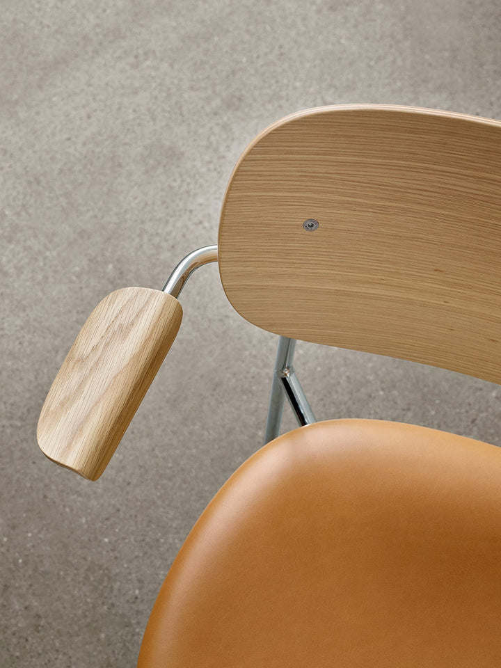 Co Dining Chair, upholstered seat with armrest, Chrome by Audo Copenhagen - Inspired by The Office Group's deep understanding of workplace requirements, the Co Chair embodies a perfect fusion of lightweight elegance and exceptional seating comfort. Additi