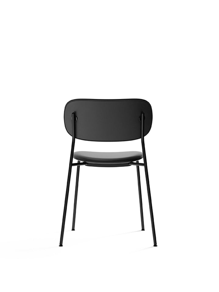 Co Dining Chair, fully upholstered, Black by Audo Copenhagen - Introducing the Co Dining Chair, a perfect blend of style and comfort. With its lightweight and streamlined profile, this chair offers an exceptional seating experience. Choose from options wi