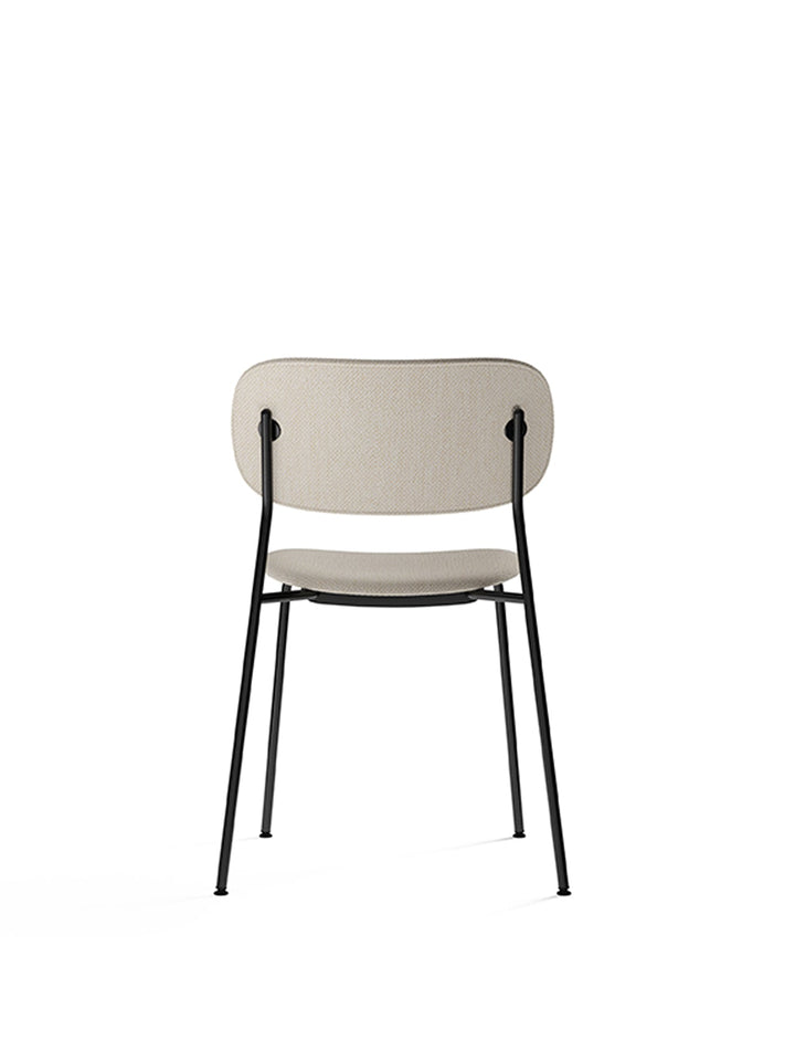 Co Dining Chair, fully upholstered, Black by Audo Copenhagen - Introducing the Co Dining Chair, a perfect blend of style and comfort. With its lightweight and streamlined profile, this chair offers an exceptional seating experience. Choose from options wi