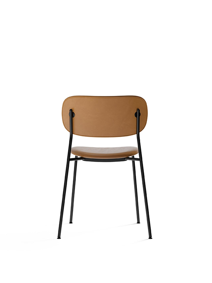 Co Dining Chair, fully upholstered, Black by Audo Copenhagen - Introducing the Co Dining Chair, a perfect blend of style and comfort. With its lightweight and streamlined profile, this chair offers an exceptional seating experience. Choose from options wi