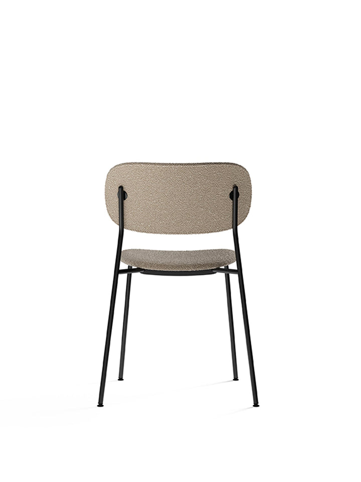 Co Dining Chair, fully upholstered, Black by Audo Copenhagen - Introducing the Co Dining Chair, a perfect blend of style and comfort. With its lightweight and streamlined profile, this chair offers an exceptional seating experience. Choose from options wi