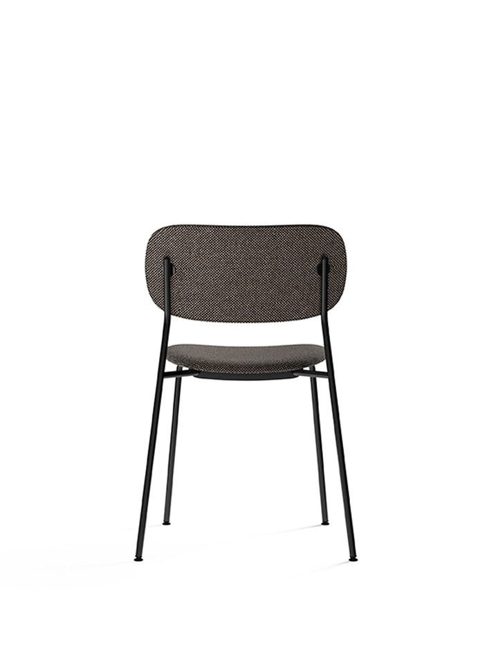 Co Dining Chair, fully upholstered, Black by Audo Copenhagen - Introducing the Co Dining Chair, a perfect blend of style and comfort. With its lightweight and streamlined profile, this chair offers an exceptional seating experience. Choose from options wi