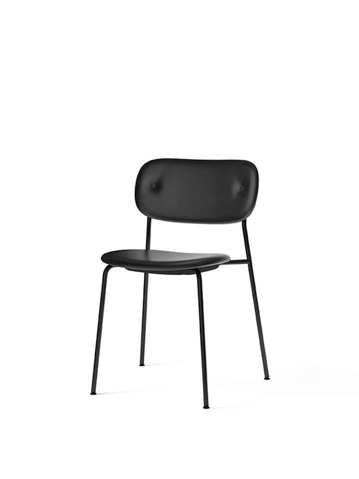 Co Dining Chair, fully upholstered, Black by Audo Copenhagen - Introducing the Co Dining Chair, a perfect blend of style and comfort. With its lightweight and streamlined profile, this chair offers an exceptional seating experience. Choose from options wi