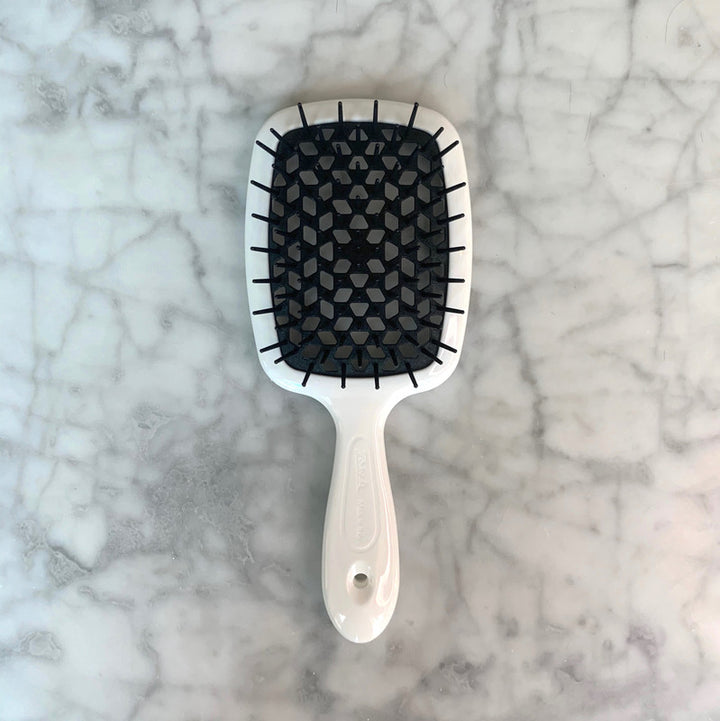 Janake Super Brush ( Multi Colours ) | Australian Stockist Introducing the Superbrush by Janake Italy. This wet-to-dry styling brush is a patented cult favourite, renowned for its effectiveness and popularity. As a professional haircare tool, the Janake S