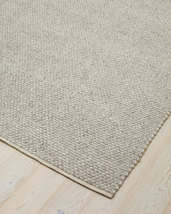 Emerson Feather - Hand-Woven Floor Rug Discover the Emerson Feather rug, a soft and textured piece made from wool and viscose, perfect for any space.