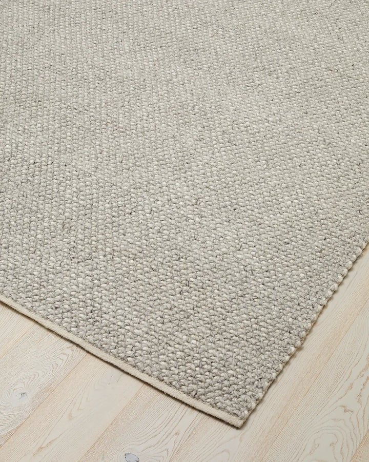 Emerson Feather - Hand-Woven Floor Rug Discover the Emerson Feather rug, a soft and textured piece made from wool and viscose, perfect for any space.