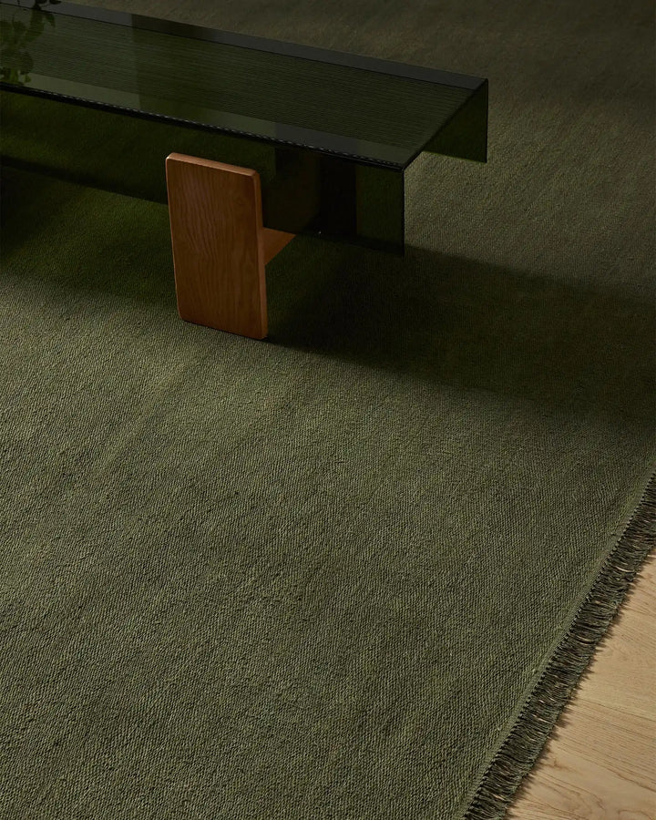 Emilio Kale - Premium Flat-Weave Linen Rug Transform your space with the Emilio Kale rug. Its deep forest green hue and fringe details offer effortless sophistication.