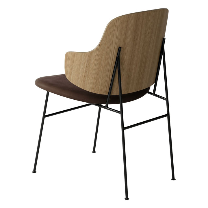The Penguin Timber Dining Chair by Audo Copenhagen - Light, elegant, sculptural and artistic, the Penguin Dining Chair is a rare Danish Modern icon designed by Danish furniture designer Ib Kofod-Larsen in 1953. When it was launched in the United States, t