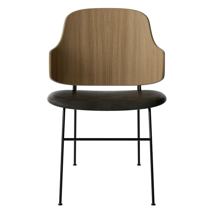 The Penguin Timber Dining Chair by Audo Copenhagen - Light, elegant, sculptural and artistic, the Penguin Dining Chair is a rare Danish Modern icon designed by Danish furniture designer Ib Kofod-Larsen in 1953. When it was launched in the United States, t
