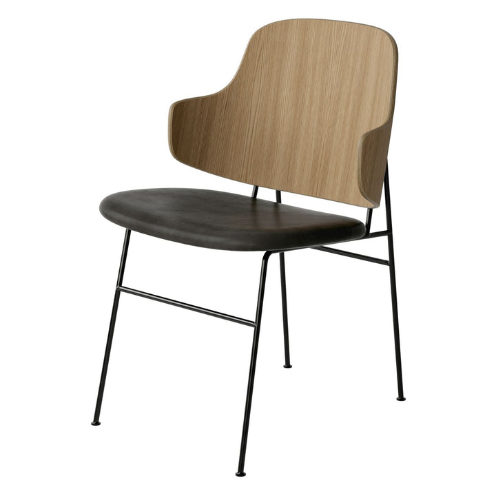 The Penguin Timber Dining Chair by Audo Copenhagen - Light, elegant, sculptural and artistic, the Penguin Dining Chair is a rare Danish Modern icon designed by Danish furniture designer Ib Kofod-Larsen in 1953. When it was launched in the United States, t