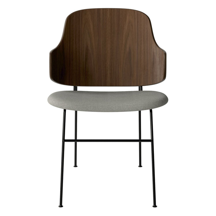 The Penguin Timber Dining Chair by Audo Copenhagen - Light, elegant, sculptural and artistic, the Penguin Dining Chair is a rare Danish Modern icon designed by Danish furniture designer Ib Kofod-Larsen in 1953. When it was launched in the United States, t