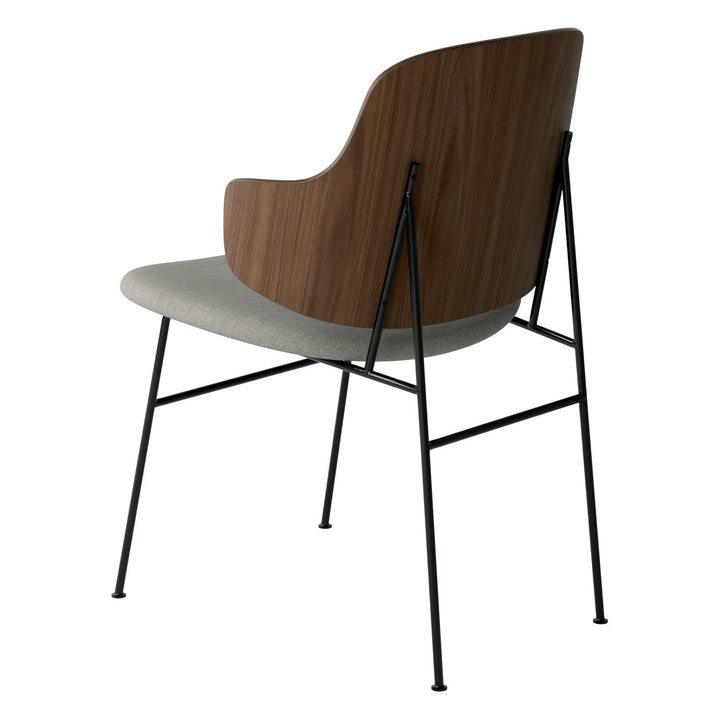 The Penguin Timber Dining Chair by Audo Copenhagen - Light, elegant, sculptural and artistic, the Penguin Dining Chair is a rare Danish Modern icon designed by Danish furniture designer Ib Kofod-Larsen in 1953. When it was launched in the United States, t