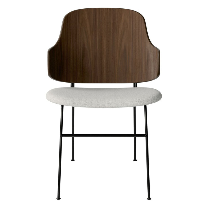 The Penguin Timber Dining Chair by Audo Copenhagen - Light, elegant, sculptural and artistic, the Penguin Dining Chair is a rare Danish Modern icon designed by Danish furniture designer Ib Kofod-Larsen in 1953. When it was launched in the United States, t