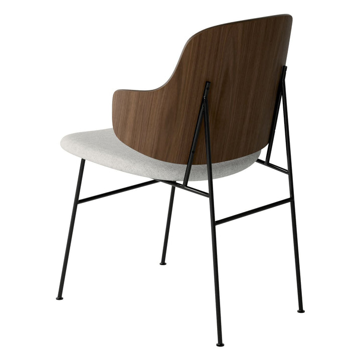 The Penguin Timber Dining Chair by Audo Copenhagen - Light, elegant, sculptural and artistic, the Penguin Dining Chair is a rare Danish Modern icon designed by Danish furniture designer Ib Kofod-Larsen in 1953. When it was launched in the United States, t