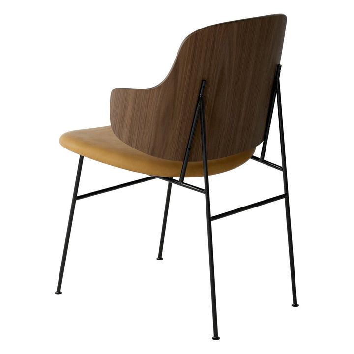 The Penguin Timber Dining Chair by Audo Copenhagen - Light, elegant, sculptural and artistic, the Penguin Dining Chair is a rare Danish Modern icon designed by Danish furniture designer Ib Kofod-Larsen in 1953. When it was launched in the United States, t