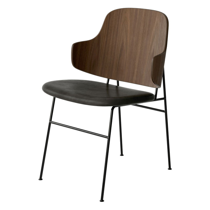 The Penguin Timber Dining Chair by Audo Copenhagen - Light, elegant, sculptural and artistic, the Penguin Dining Chair is a rare Danish Modern icon designed by Danish furniture designer Ib Kofod-Larsen in 1953. When it was launched in the United States, t