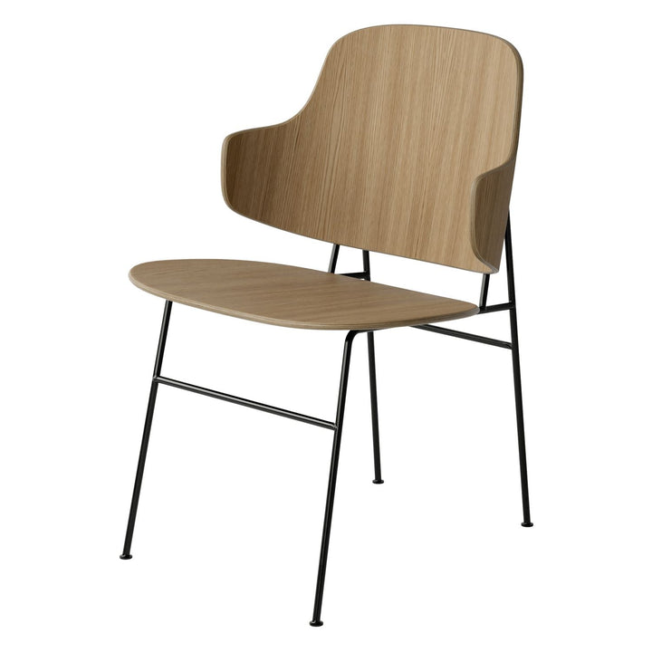 The Penguin Timber Dining Chair by Audo Copenhagen - Light, elegant, sculptural and artistic, the Penguin Dining Chair is a rare Danish Modern icon designed by Danish furniture designer Ib Kofod-Larsen in 1953. When it was launched in the United States, t