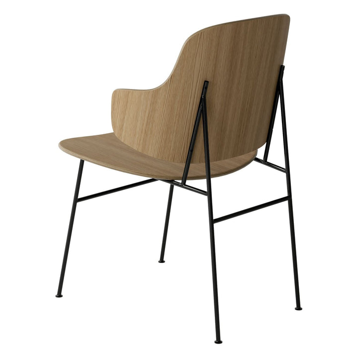 The Penguin Timber Dining Chair by Audo Copenhagen - Light, elegant, sculptural and artistic, the Penguin Dining Chair is a rare Danish Modern icon designed by Danish furniture designer Ib Kofod-Larsen in 1953. When it was launched in the United States, t