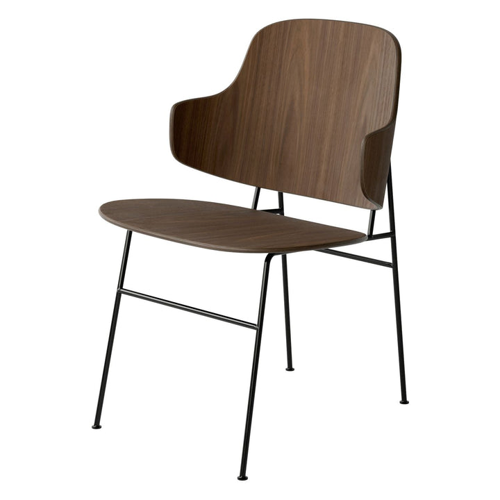 The Penguin Timber Dining Chair by Audo Copenhagen - Light, elegant, sculptural and artistic, the Penguin Dining Chair is a rare Danish Modern icon designed by Danish furniture designer Ib Kofod-Larsen in 1953. When it was launched in the United States, t
