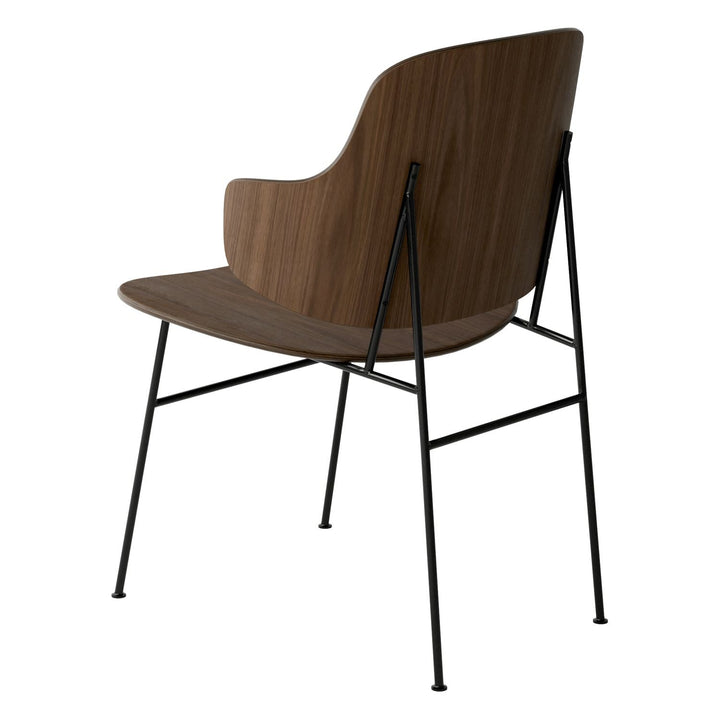 The Penguin Timber Dining Chair by Audo Copenhagen - Light, elegant, sculptural and artistic, the Penguin Dining Chair is a rare Danish Modern icon designed by Danish furniture designer Ib Kofod-Larsen in 1953. When it was launched in the United States, t