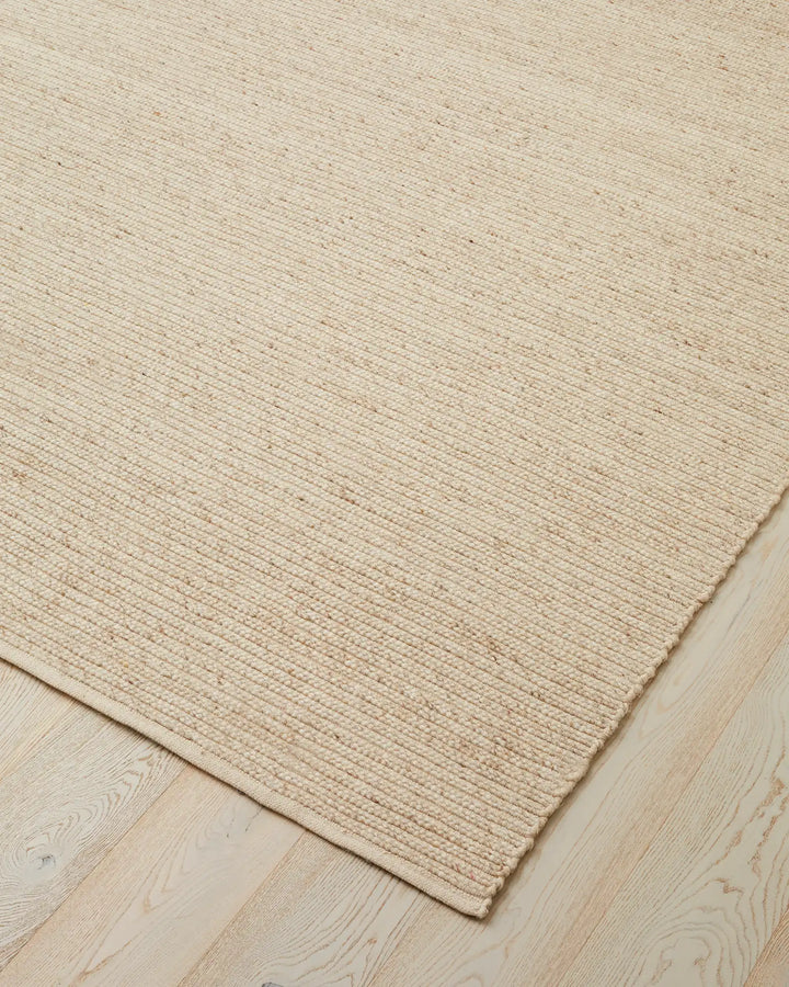 Andes Sandstorm - Hand-Woven Textured Floor Rug Discover the Andes Sandstorm rug, a stylish hand-woven floor piece perfect for coastal decor with warm cream tones and natural textures.