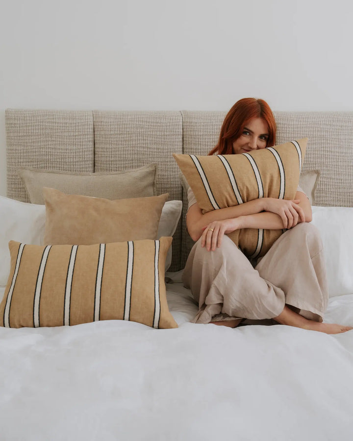 Ava Nougat Cushion - Luxurious Velvet Comfort Discover the Ava Nougat cushion in creamy beige, a luxurious addition to your space with over 20 colorways and a soft velvet-like texture.