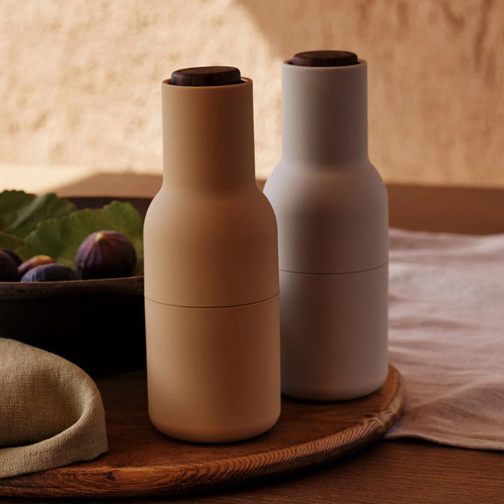 AUDO CPH (ex MENU) Salt and Pepper Bottle Grinder Set, Barley w/ Walnut Lid by Audo Copenhagen - MENU Bottle Grinders have a rounded base that fits perfectly into your hand and a tactile rubber surface that is easy to grip and clean. The grinders have a p